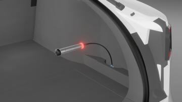 WLT 13 shape memory attachment bent into position and used with WLTe tester to detect water ingress, confirmed by visual and acoustic alert in automotive interior